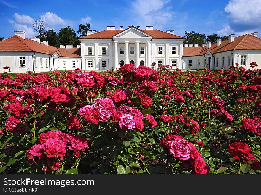 Classical palace with the garden into a sunny day