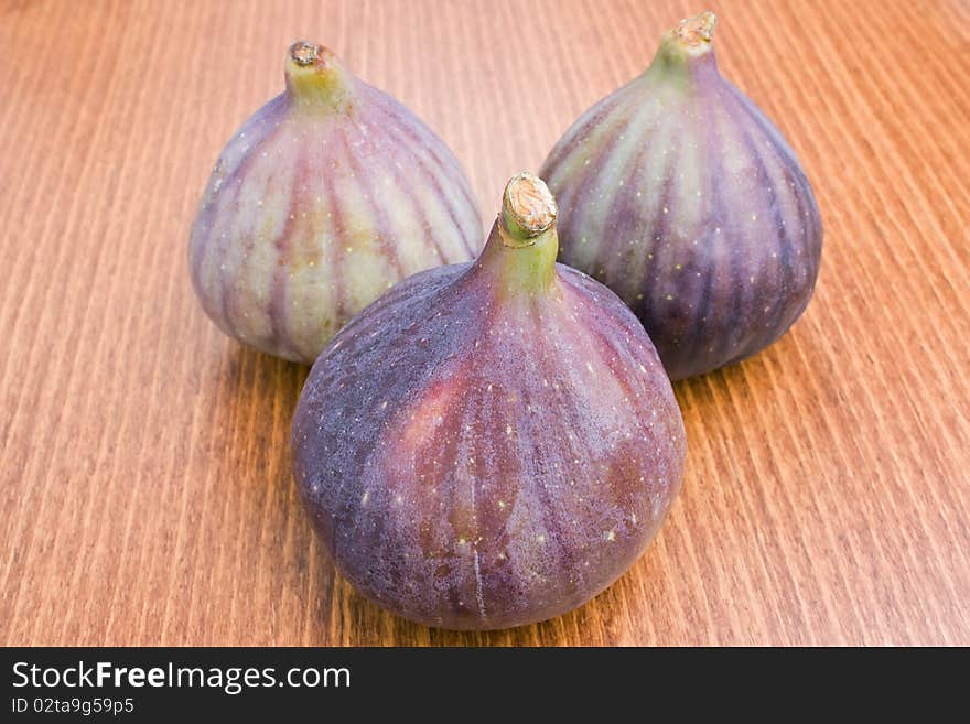 Three delicious fresh ripe figs close-up