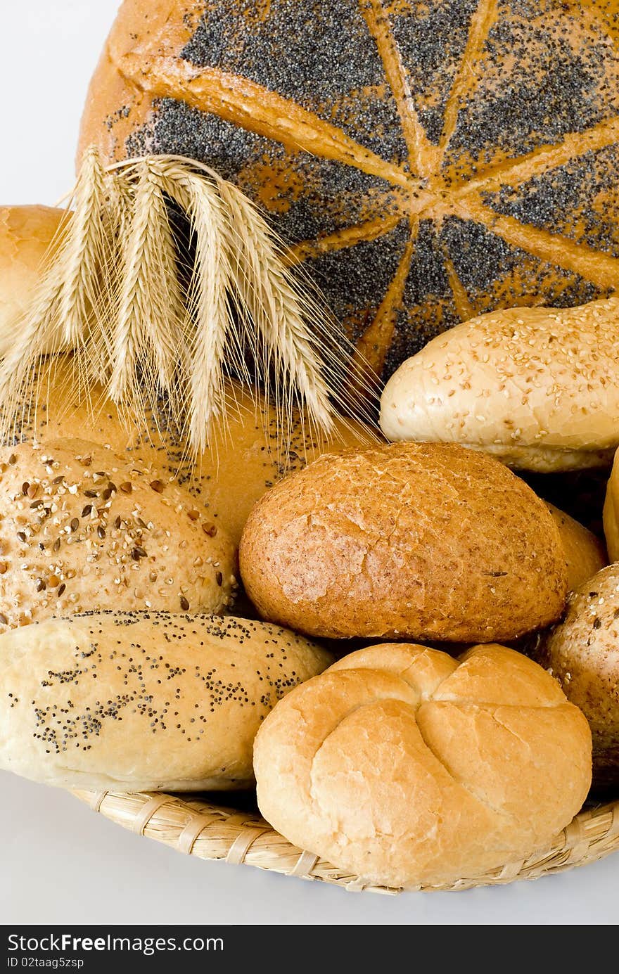 Fresh bread in the basket on the white background