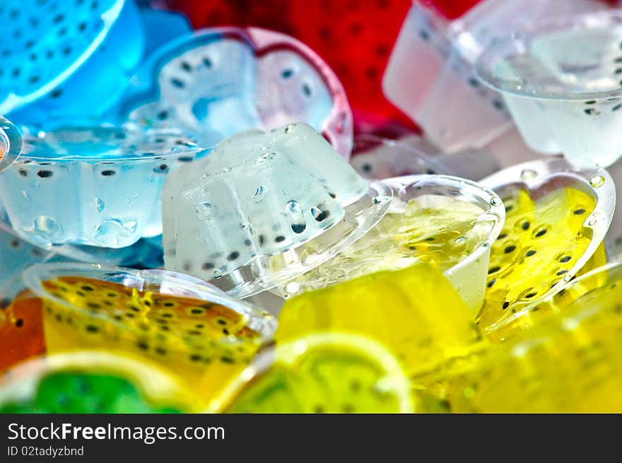 Many color jelly it make of fruit juice mix with gelatin ,it is a cool and delicious dessert. Many color jelly it make of fruit juice mix with gelatin ,it is a cool and delicious dessert