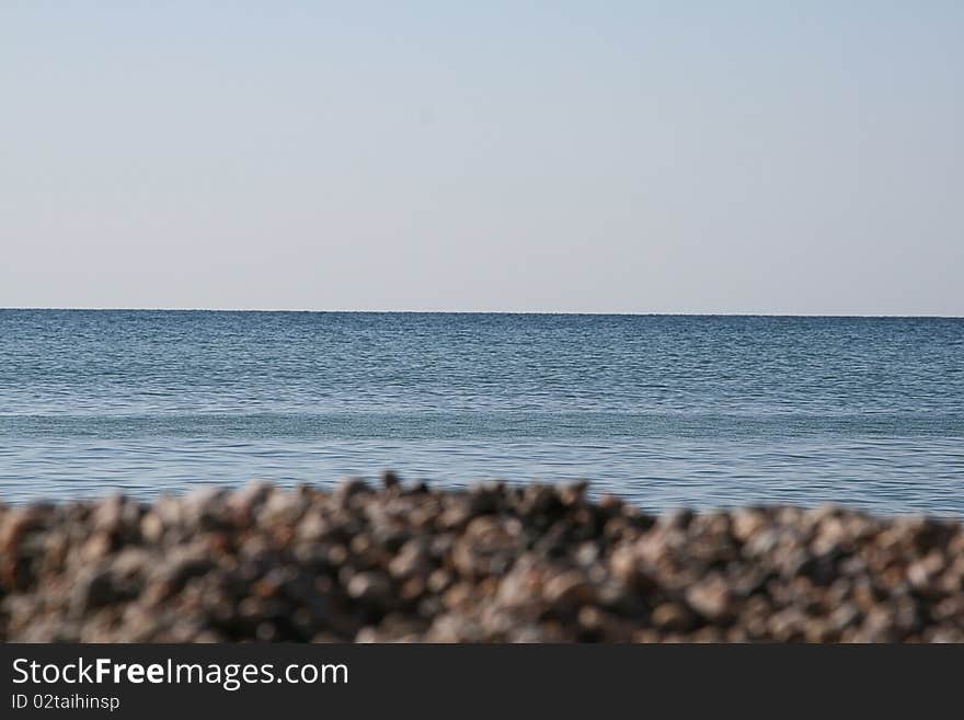 Small stones on the background of the sea. Small stones on the background of the sea