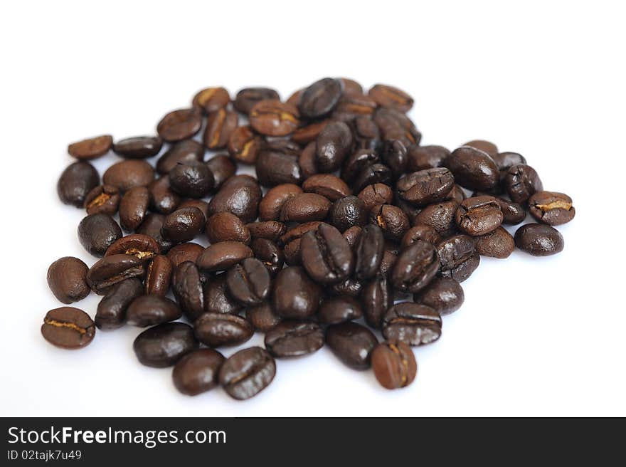 Coffee beans close-up in white background.