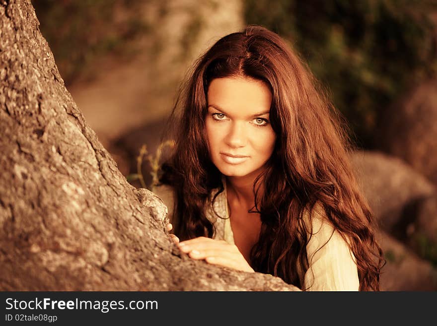 Woman recline on the tree. Woman recline on the tree