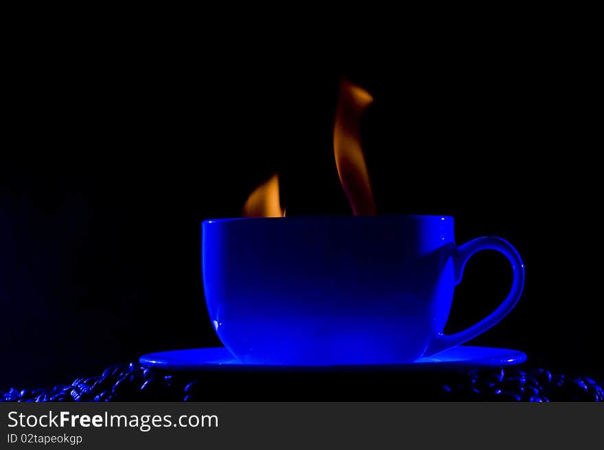 Coffee cup with steam on black background