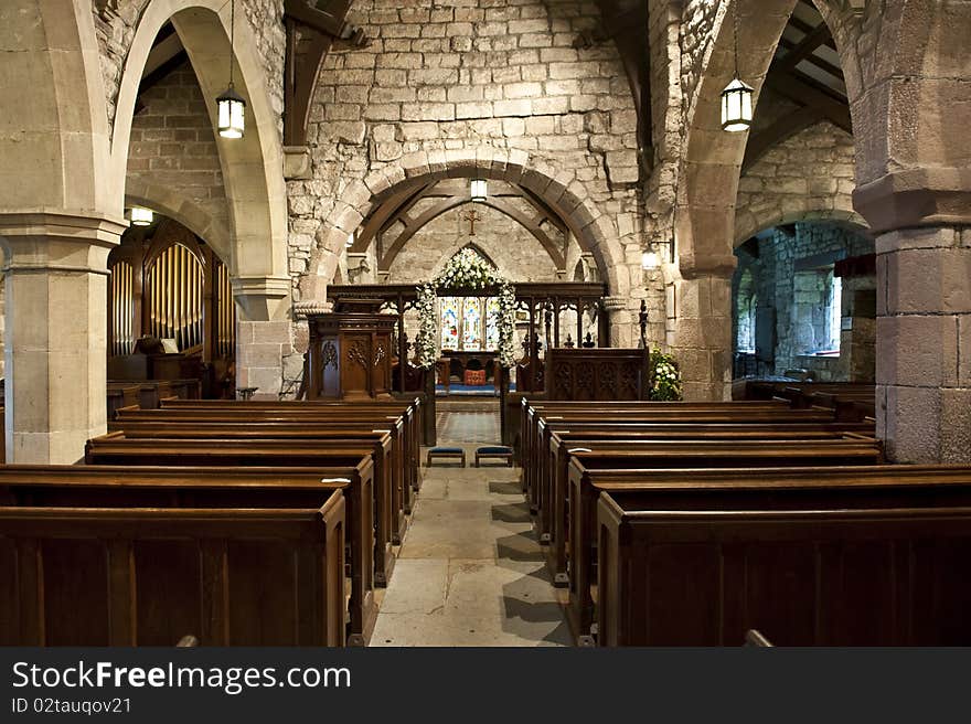 Church interior showing centre isle and pews