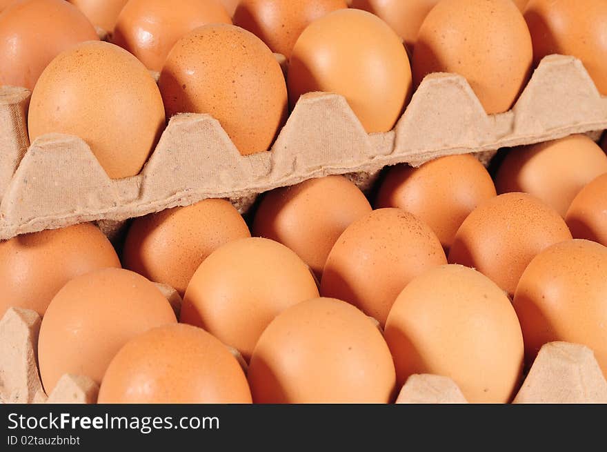 Brown egg stack on carton. Brown egg stack on carton.