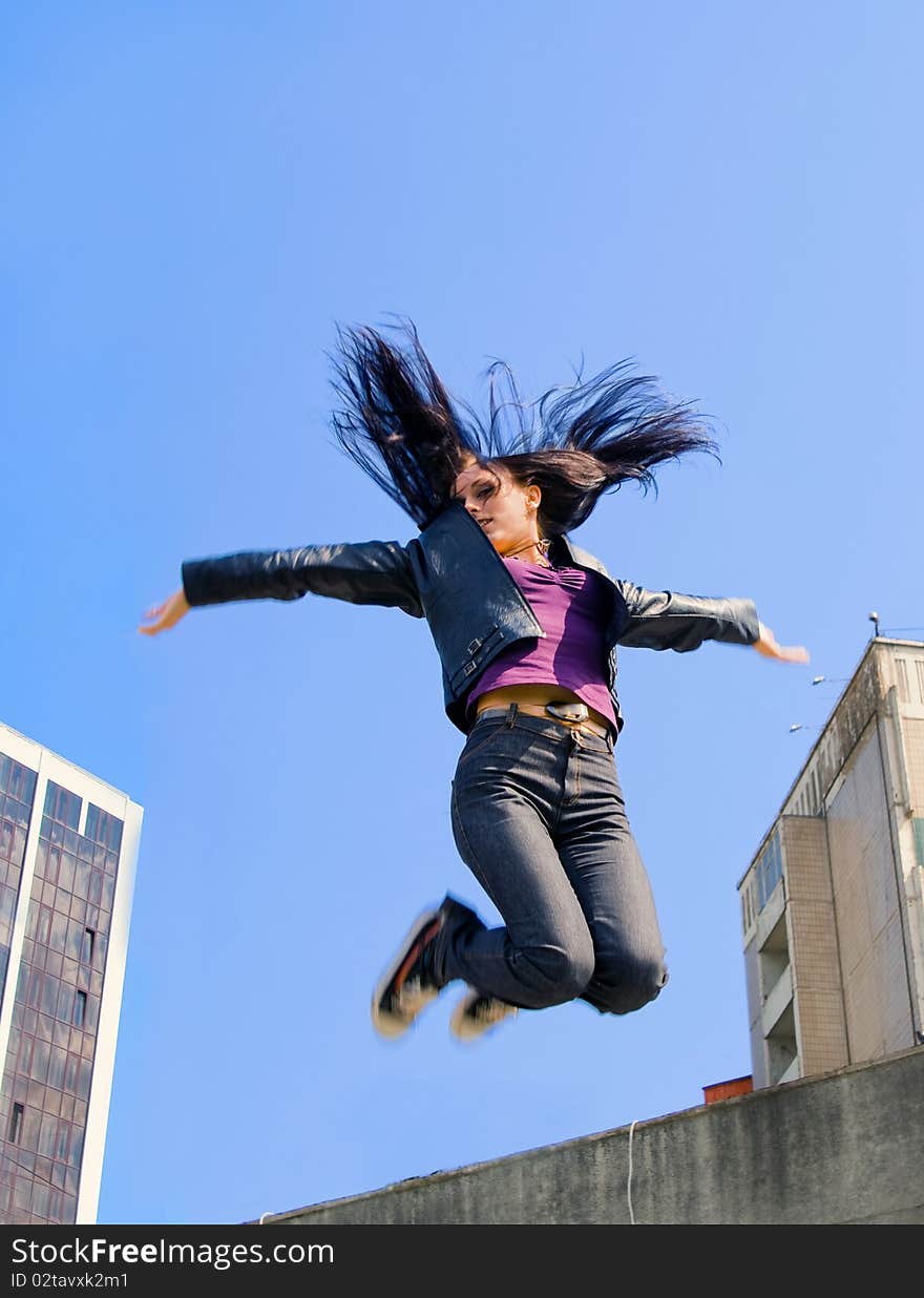 Young girl jumping to the sky. Young girl jumping to the sky