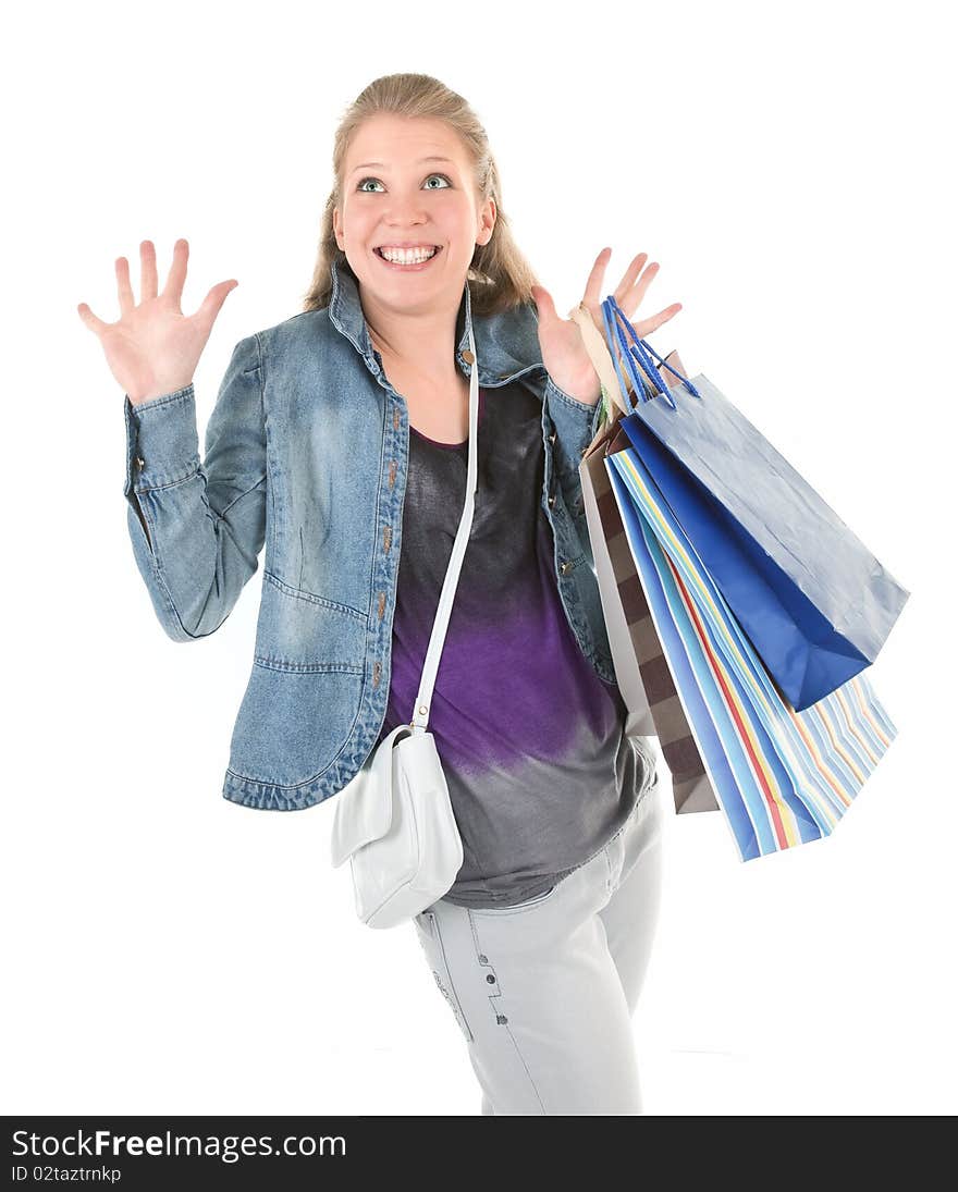 Young girl with purchases on white background