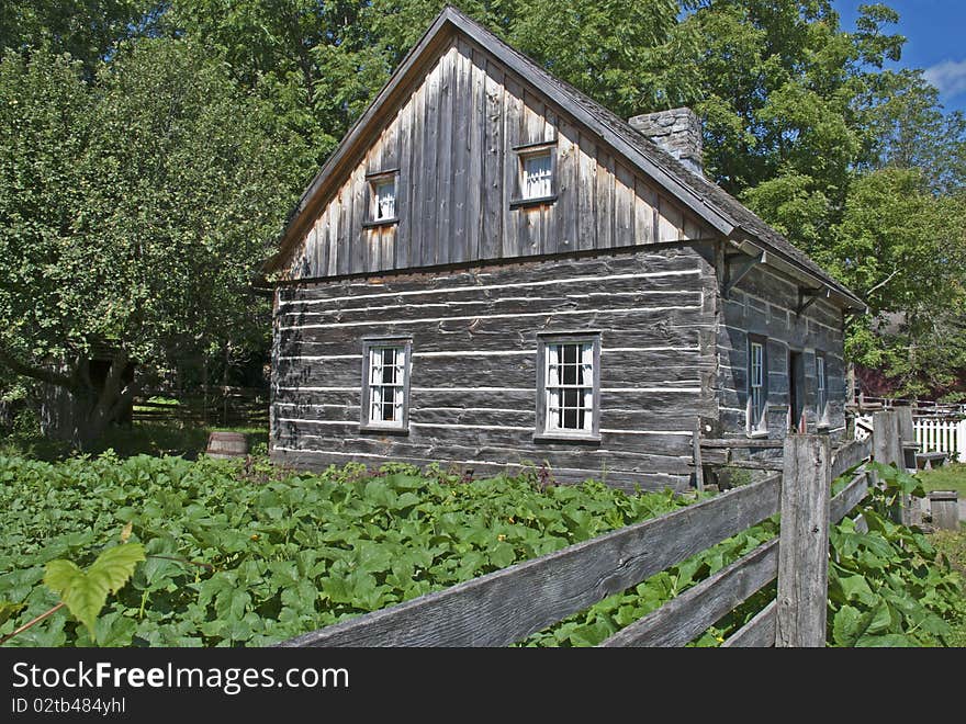 Old farmhouse with squash garden