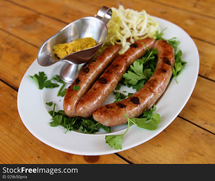 Delicious food ,sausage and cabbage with mastered. Delicious food ,sausage and cabbage with mastered