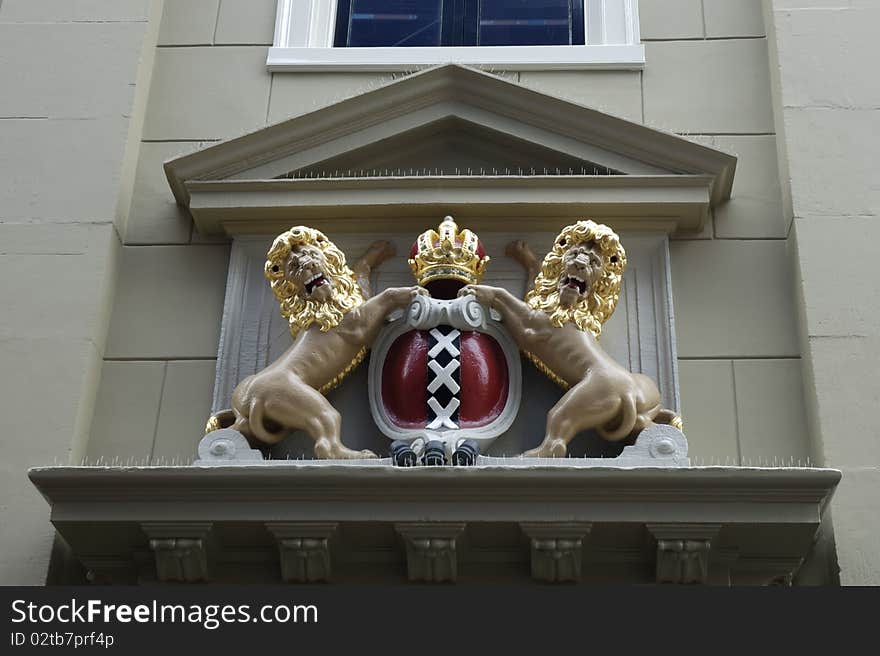 Decorative house facade with emblem of Amsterdam, Netherlands. Decorative house facade with emblem of Amsterdam, Netherlands.