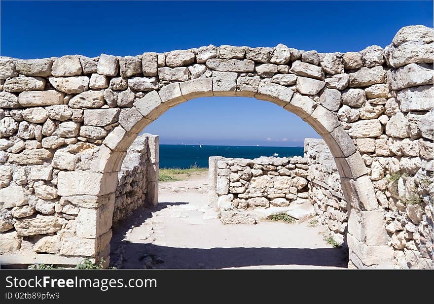 Ruins of ancient city against sea