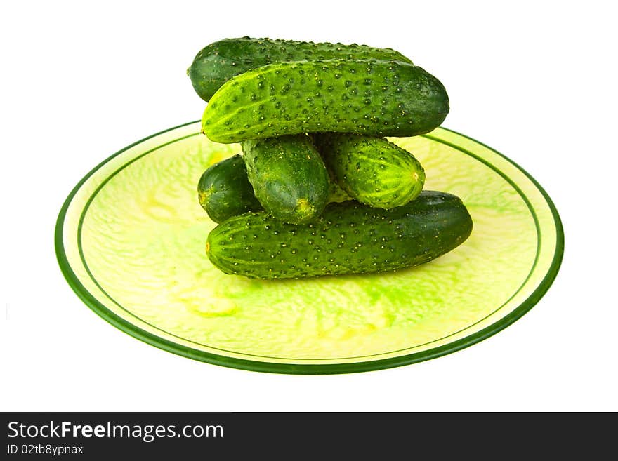 Cucumbers, piled on a plate. Cucumbers, piled on a plate