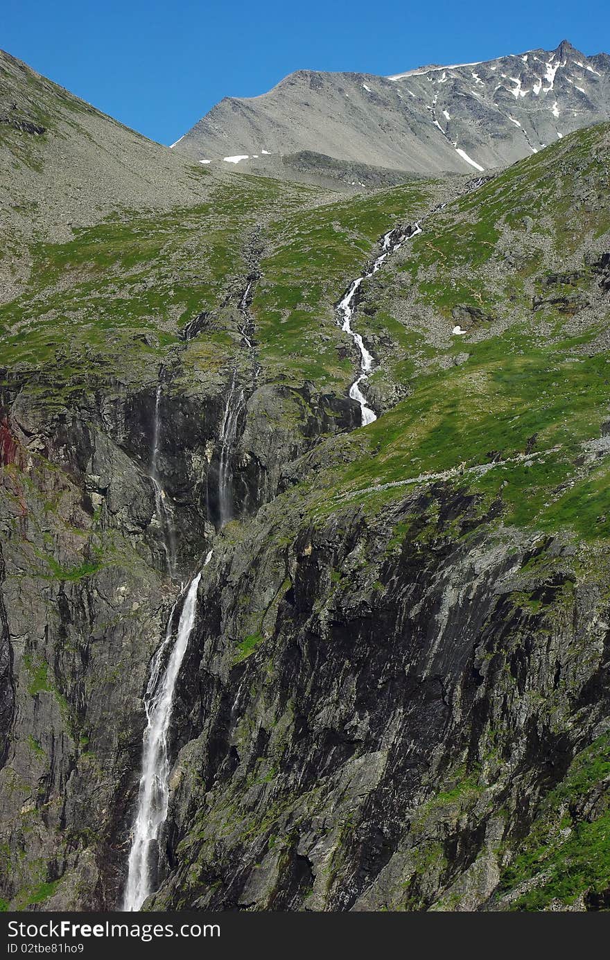 Mountain river with waterfall in Norway