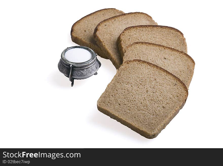 Bread and salt isolated over white background