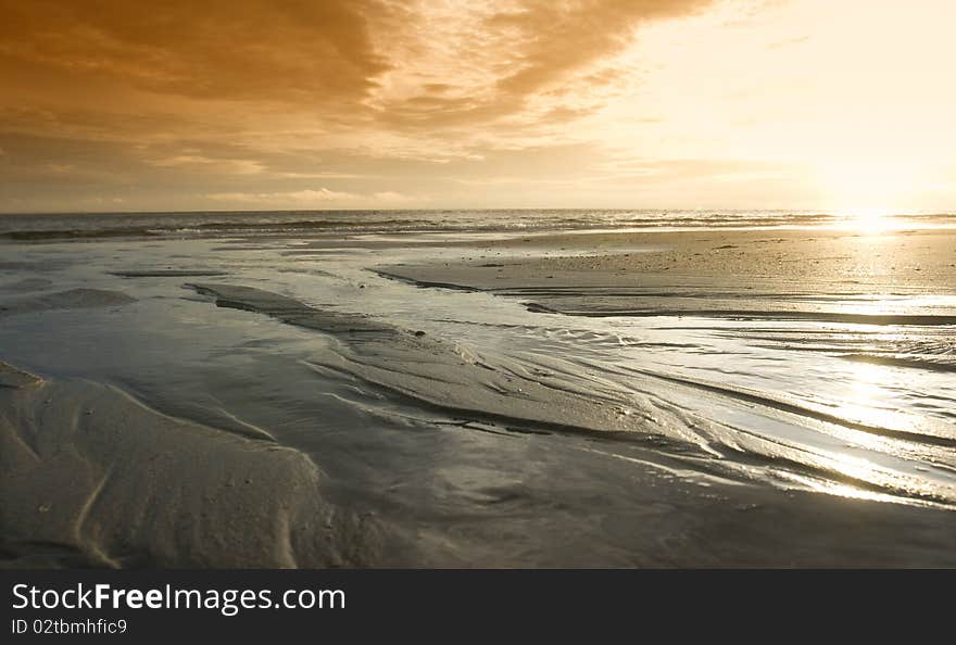 North sea Beach Holland at sunset during summertime. North sea Beach Holland at sunset during summertime