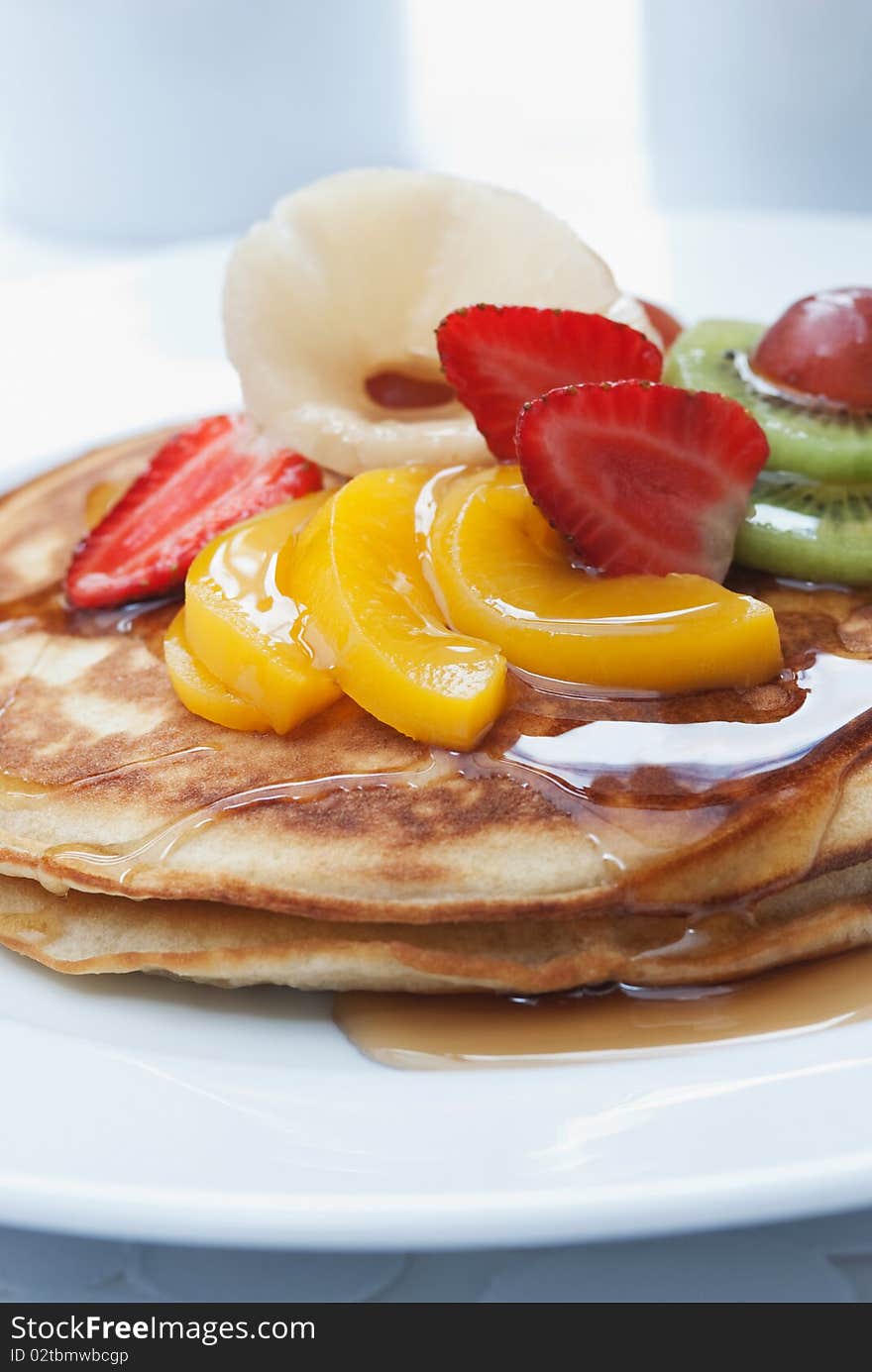 Breakfast pancakes with fruit topping