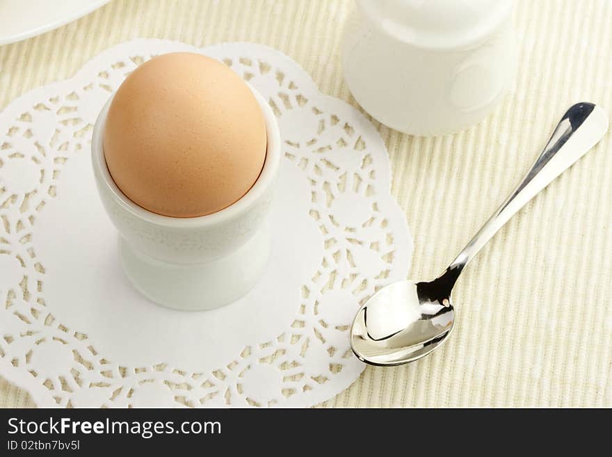 Breakfast table with boiled egg