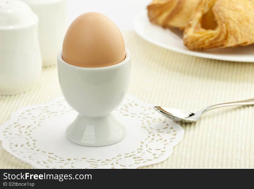 Breakfast table with a boiled egg