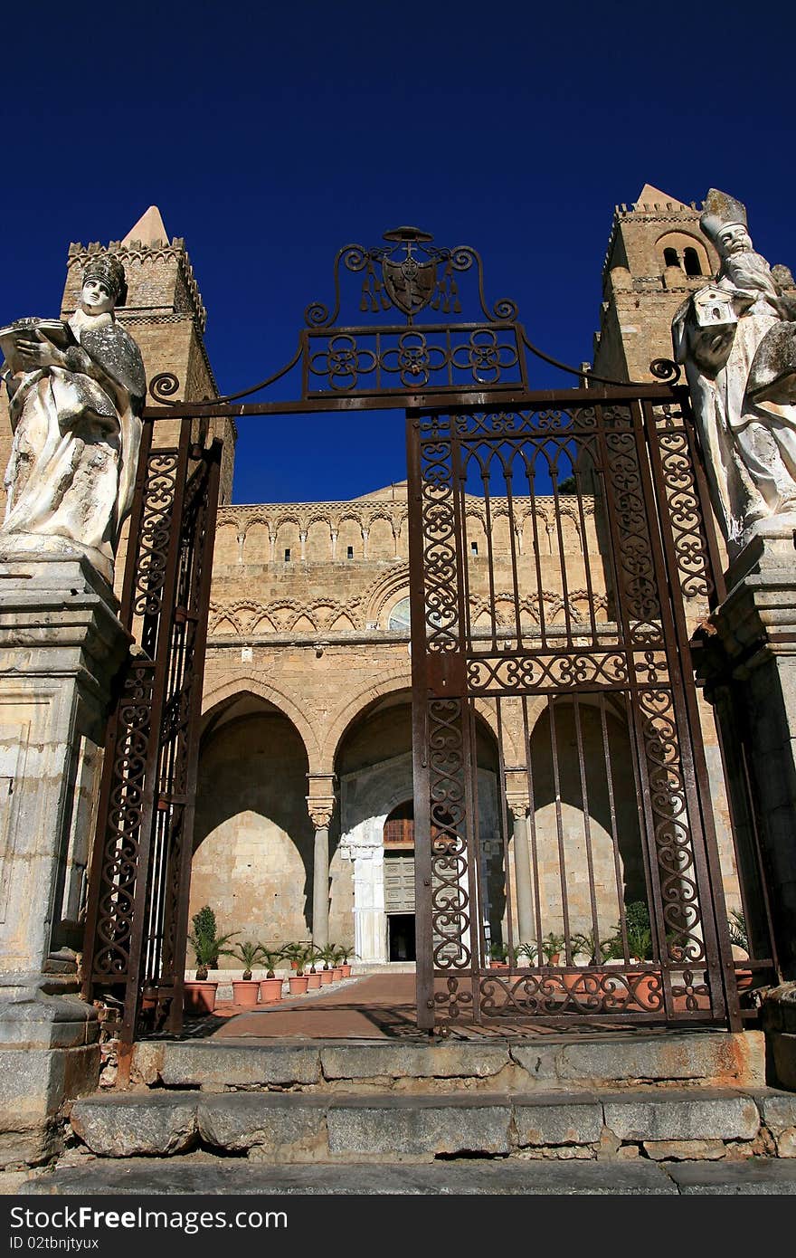 Cefalu ancient norman cathedral towers on blue summer sky, Island of Sicily - Italy. Cefalu ancient norman cathedral towers on blue summer sky, Island of Sicily - Italy