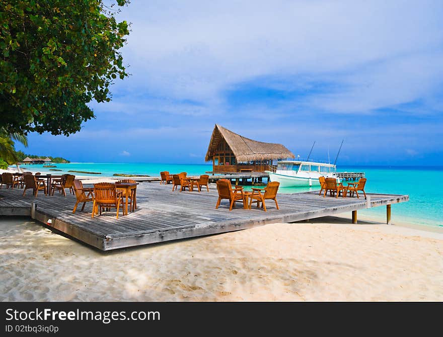 Cafe on the beach, ocean and sky