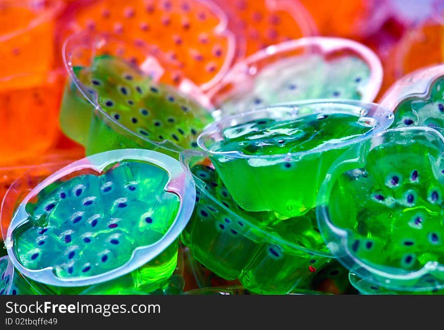 Many color jelly it make of fruit juice mix with gelatin ,it is a cool and delicious dessert. Many color jelly it make of fruit juice mix with gelatin ,it is a cool and delicious dessert