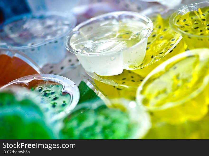 Many color jelly it make of fruit juice mix with gelatin ,it is a cool and delicious dessert. Many color jelly it make of fruit juice mix with gelatin ,it is a cool and delicious dessert