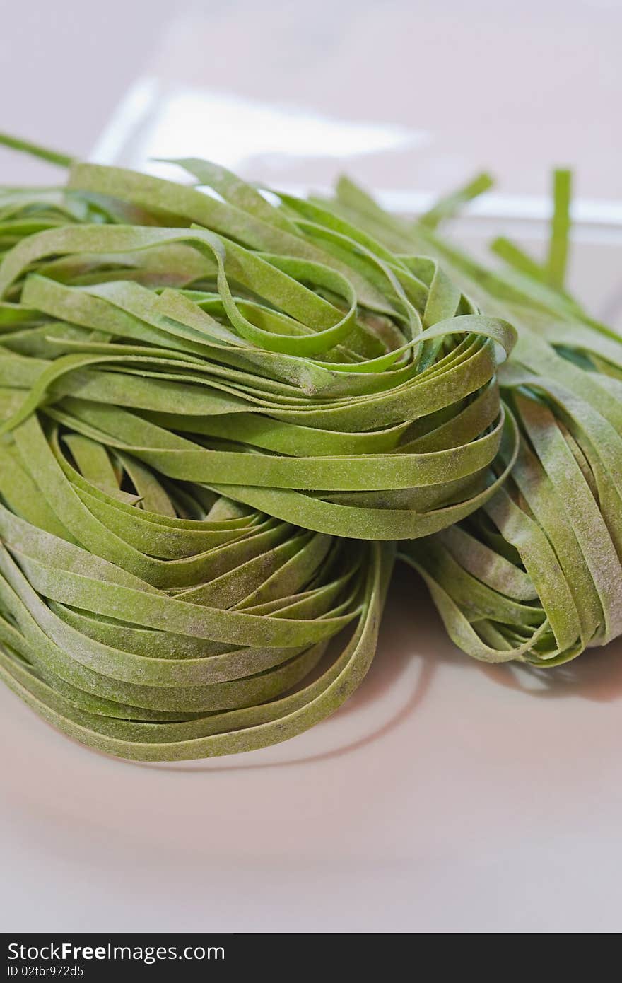 Close up picture of green colored uncooked pasta. Close up picture of green colored uncooked pasta