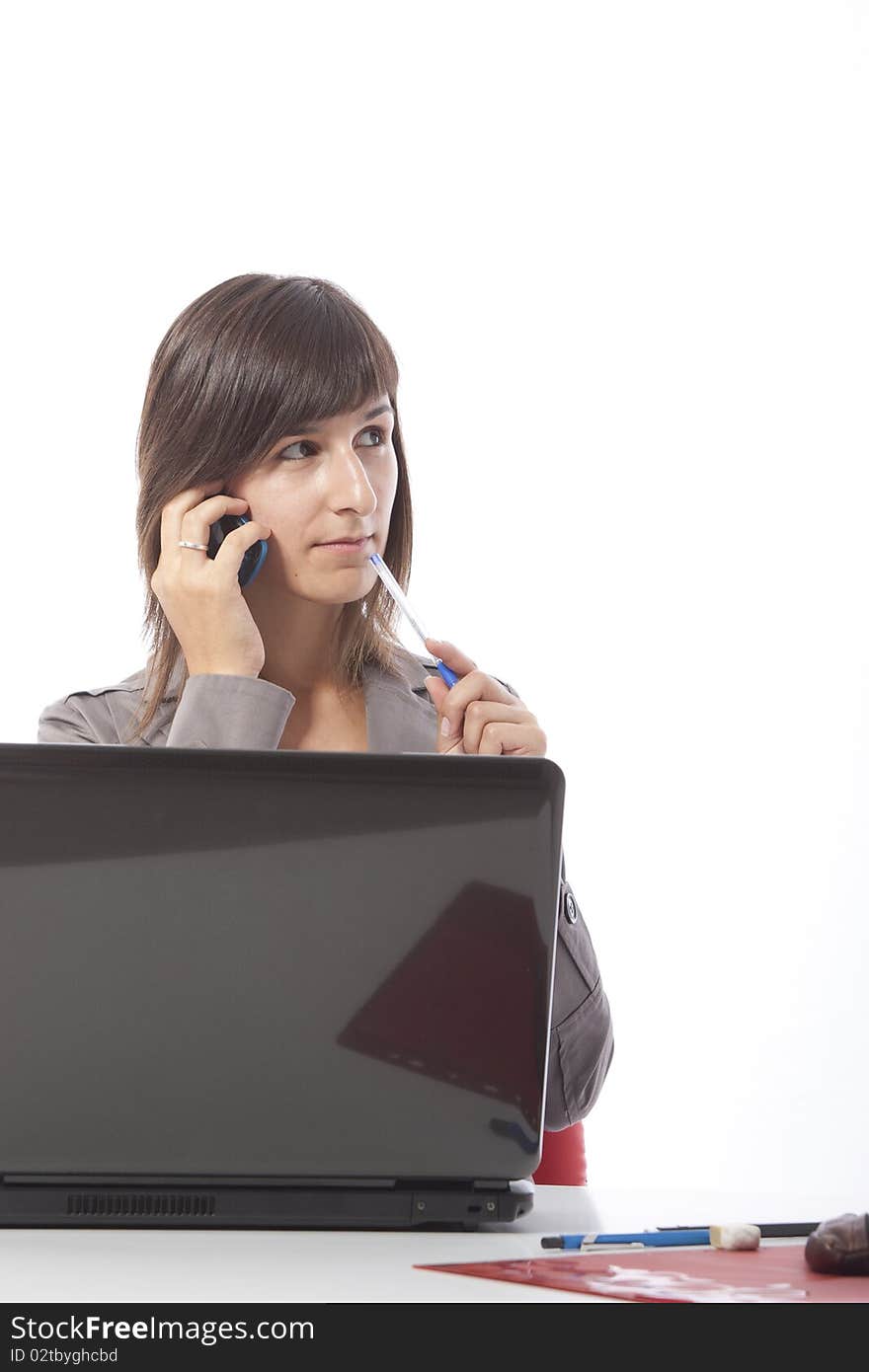 This photo shows a business woman talking on the phone.