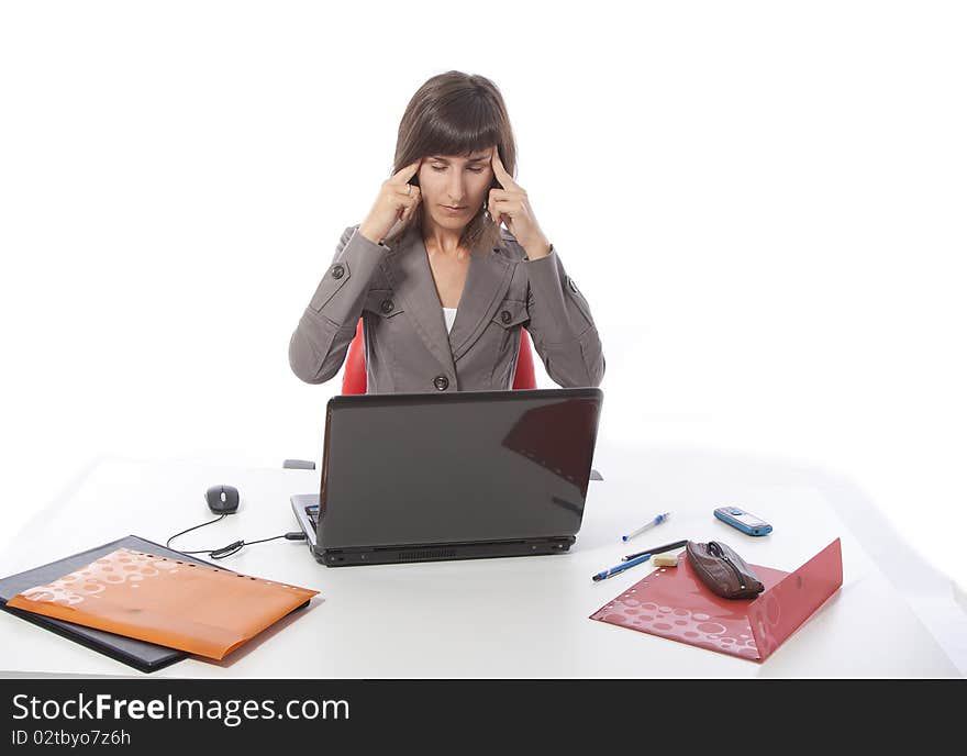 This photo shows a business woman working on a computer. This photo shows a business woman working on a computer.