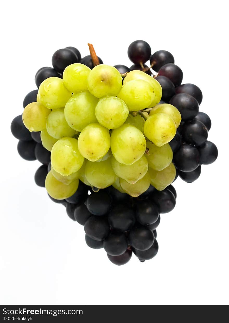 Bunch of green and black grapes isolated on white