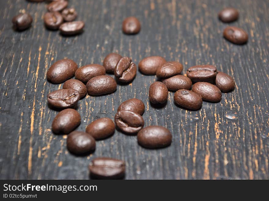 The grunge background fragrant fried coffee beans. The grunge background fragrant fried coffee beans