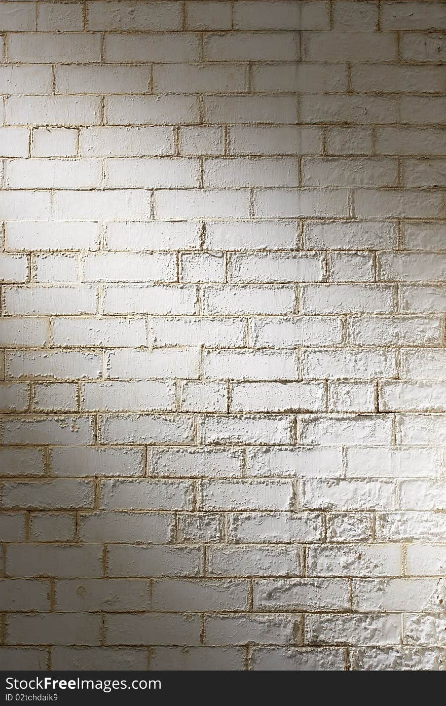 White brick wall background with peeling paint