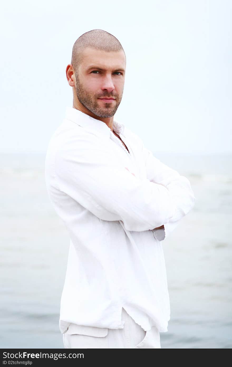 Attractive and happy man on beach