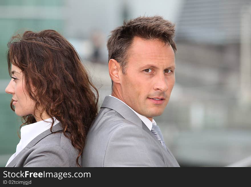 Portrait of business partners standing outside. Portrait of business partners standing outside