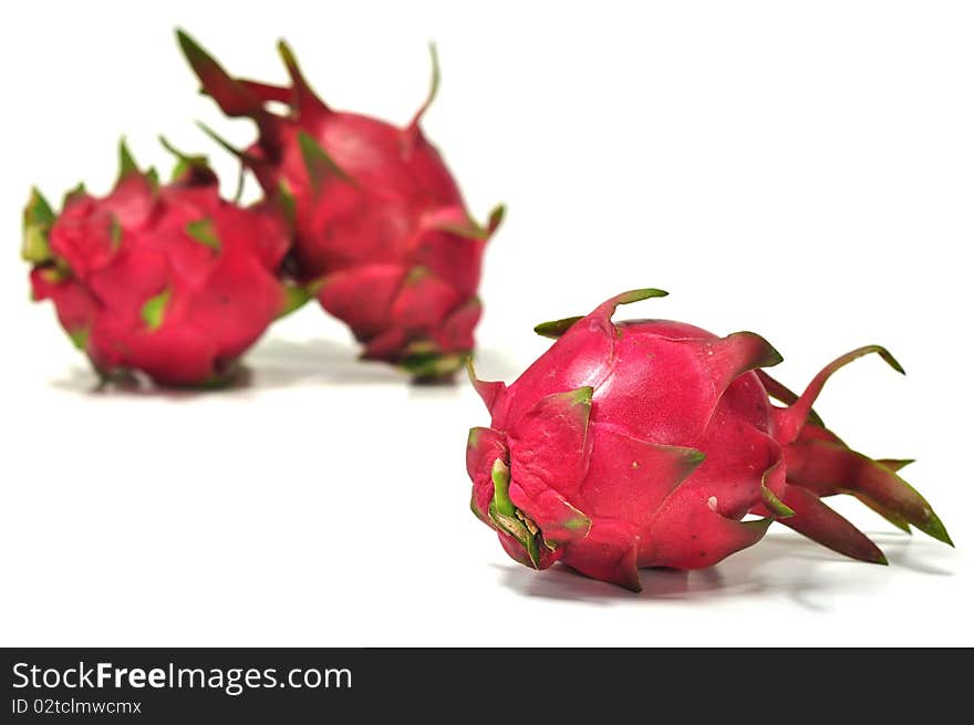 The fresh beautiful dragon fruits in the white background