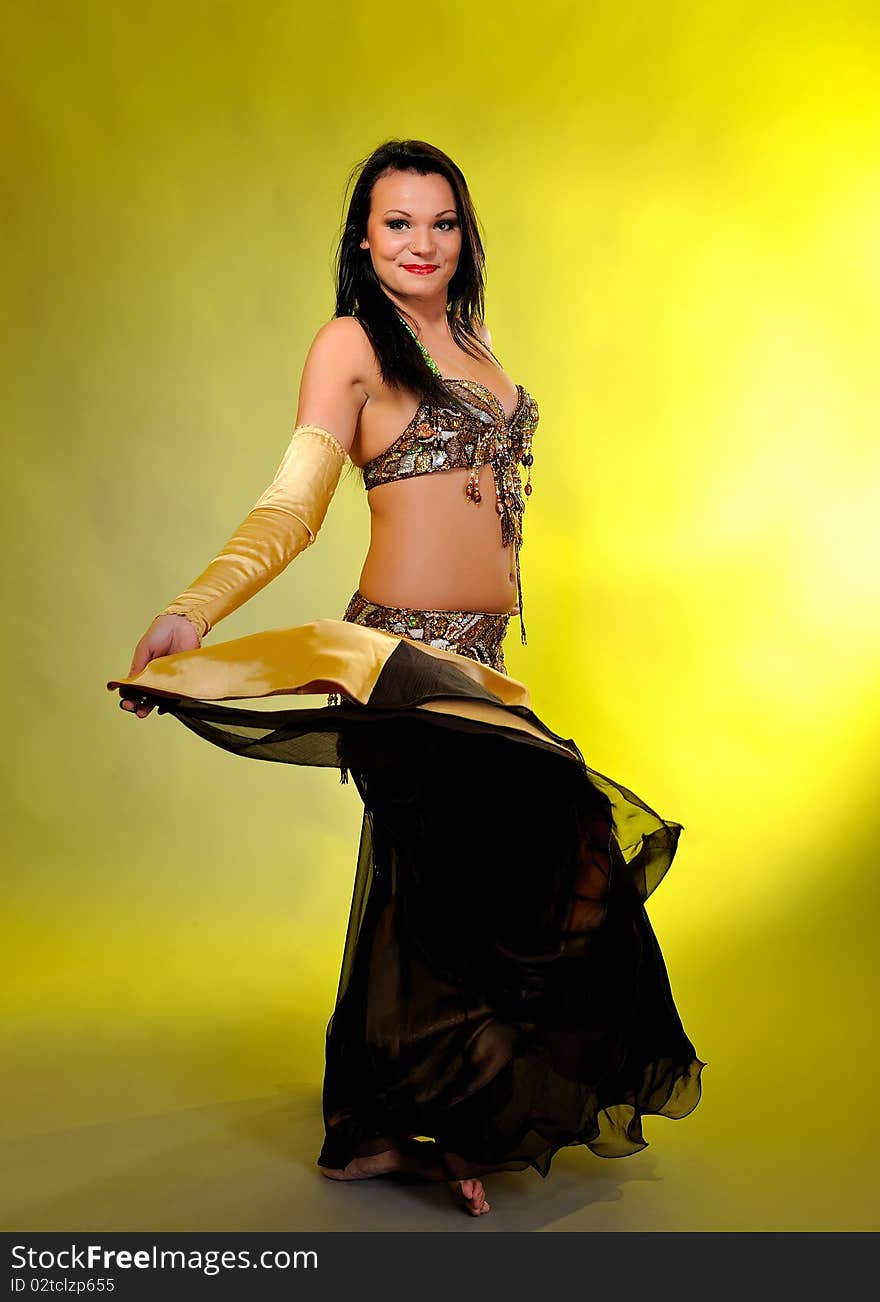 Beautiful dancer woman in bellydance costume with pretty professional stage make-up