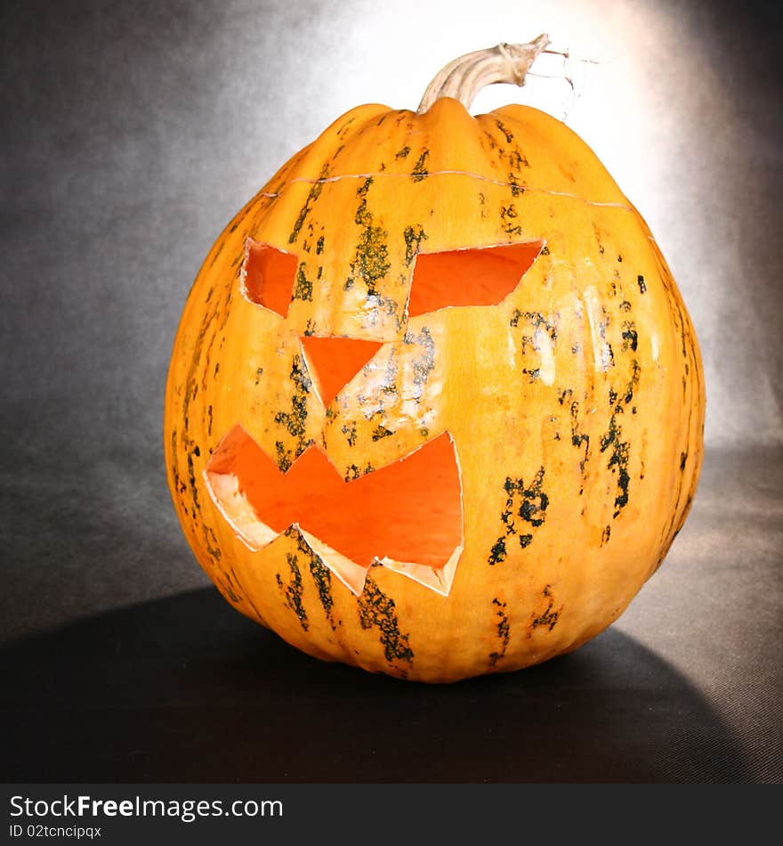 Illuminated Jack-o-lantern glowing on black background