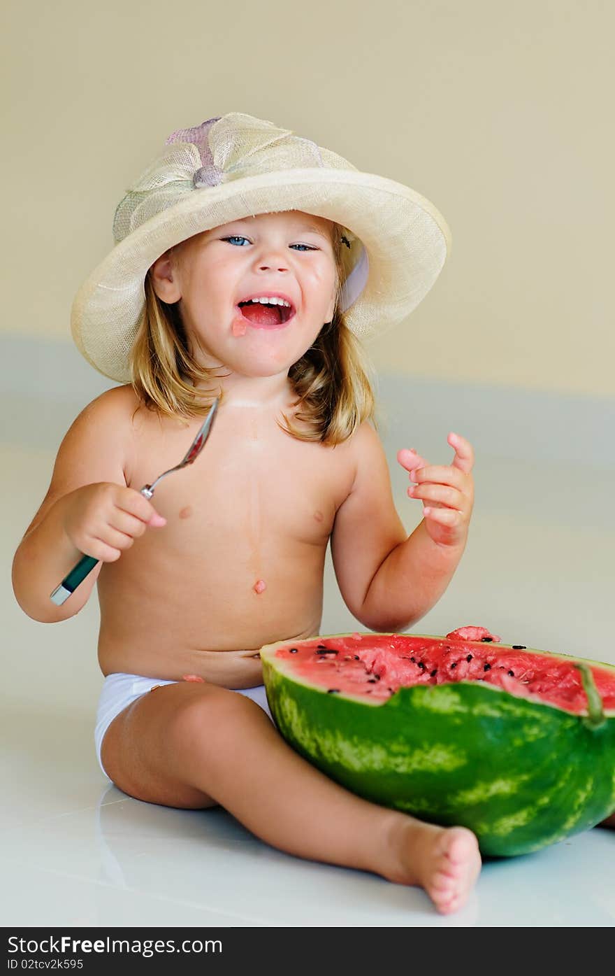 Funny cute girl in hat eating with appetite ripe watermelon. Funny cute girl in hat eating with appetite ripe watermelon