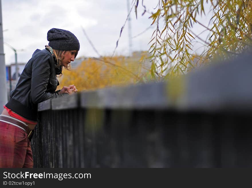 The girl observes from the bridge. The girl observes from the bridge