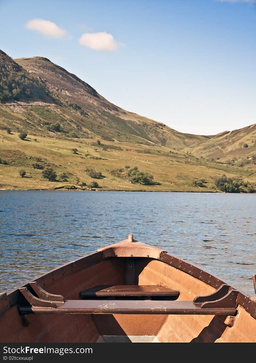 Lake district cumbria mountain view and wooden boat