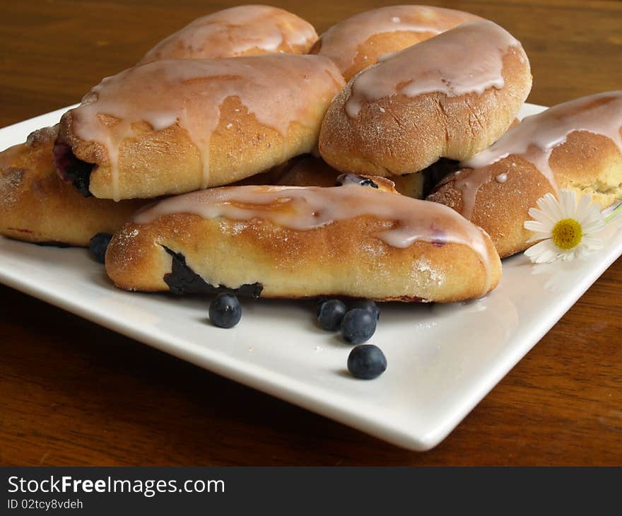 Sweet buuls withblueberries on a plate. Sweet buuls withblueberries on a plate