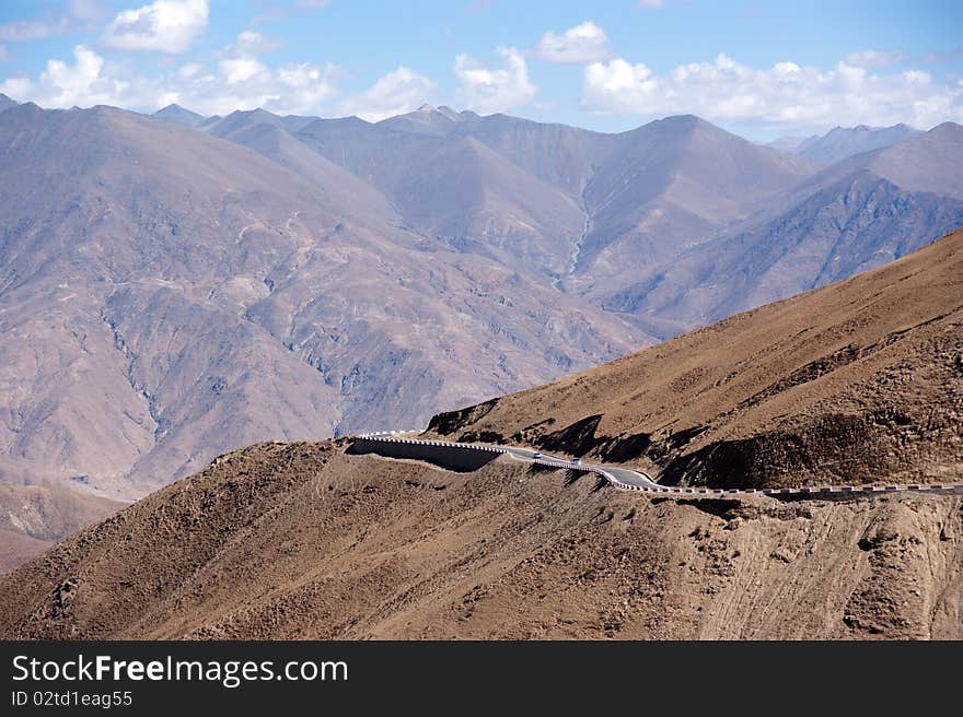 Yellowish mountain road view in tibet of China