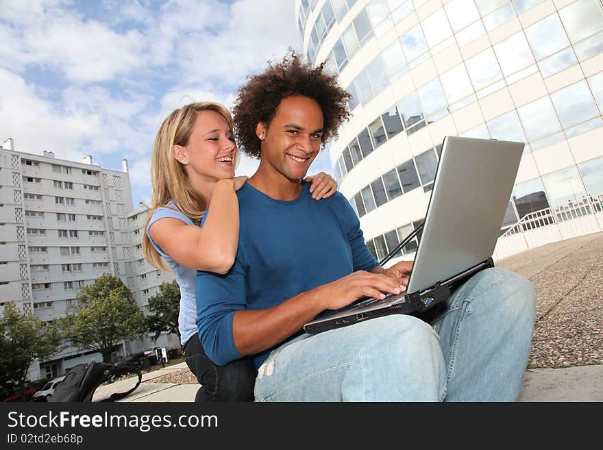 Young people in front of college building