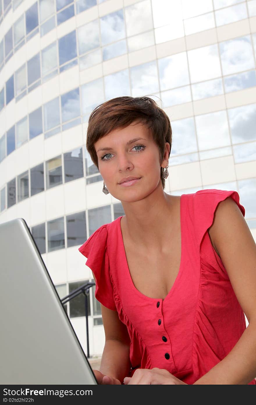 Student at college campus with laptop computer. Student at college campus with laptop computer