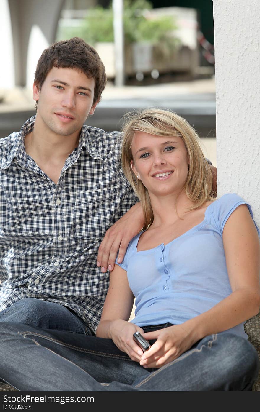 Young couple of students with mobile phone. Young couple of students with mobile phone