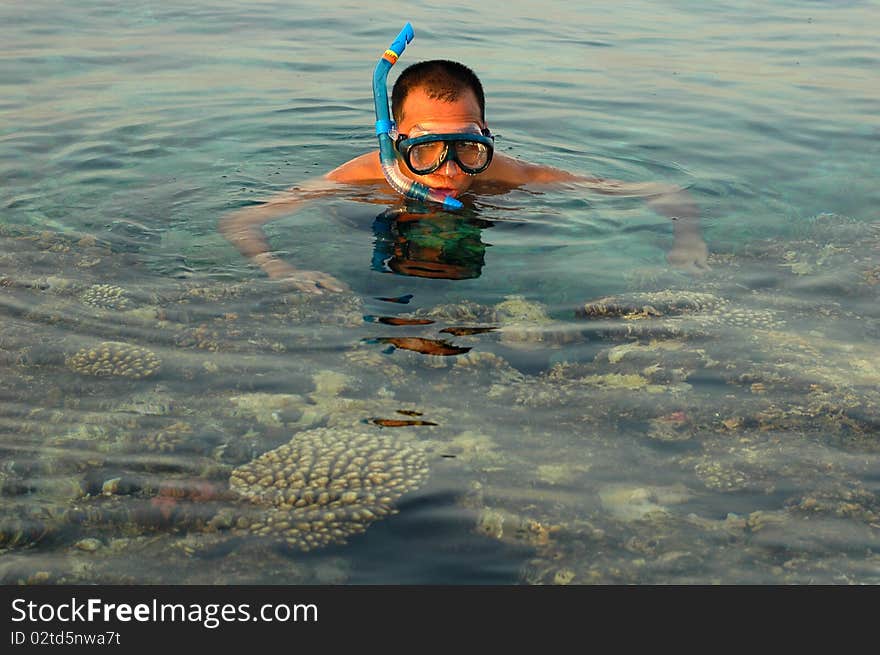 A man snorkeling in the sea