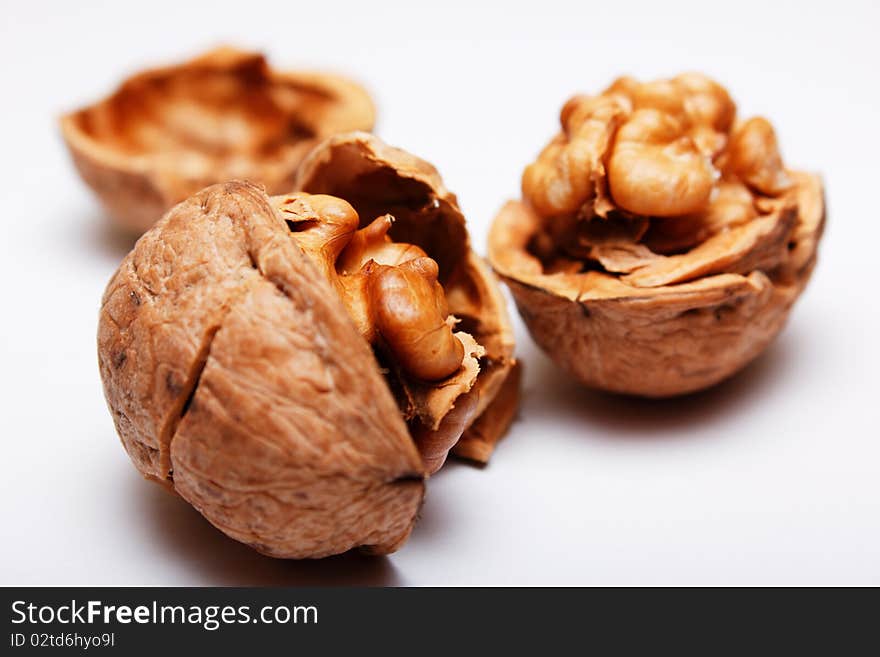 Walnuts isolated on white background under warm light