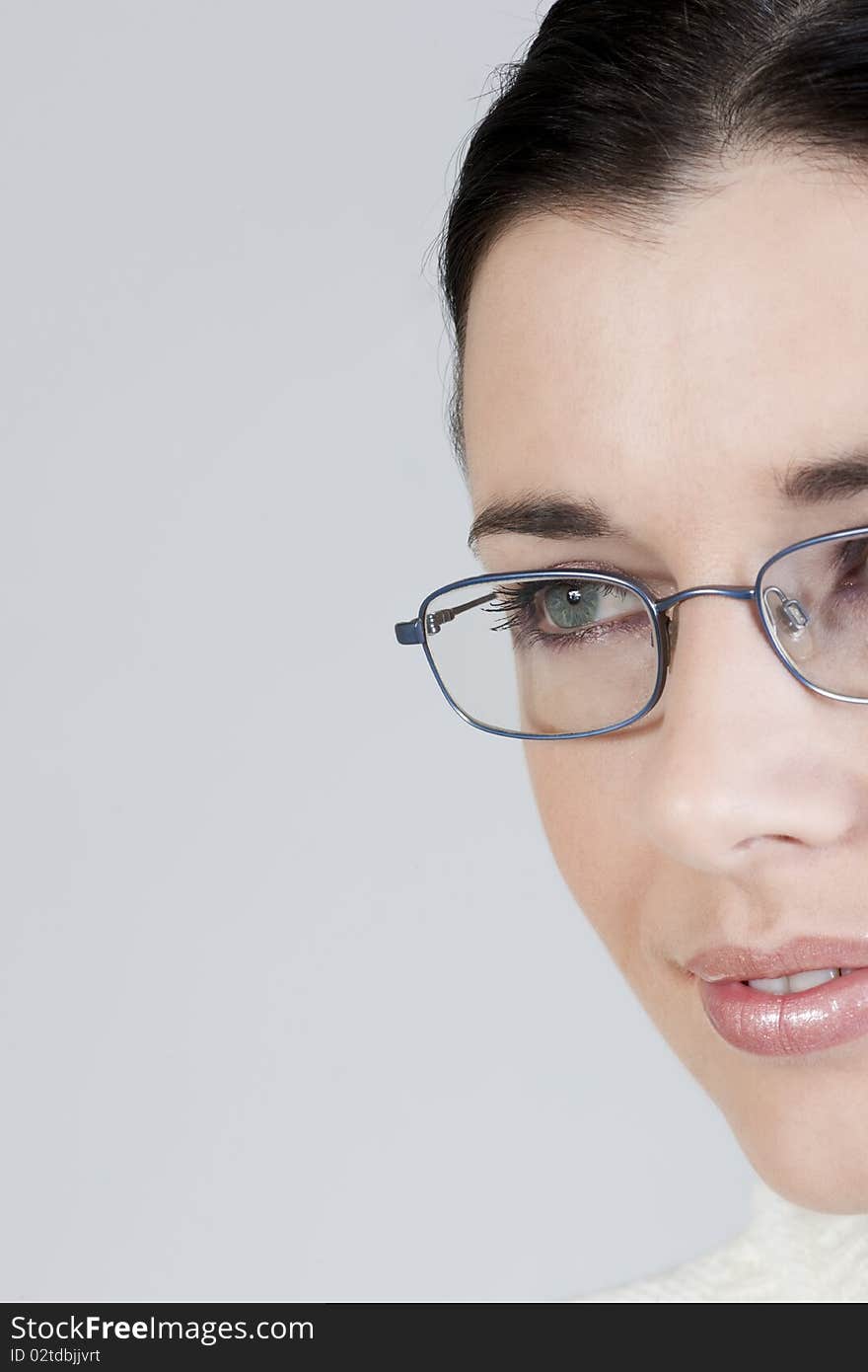 Close-up of a beautiful young woman with glasses