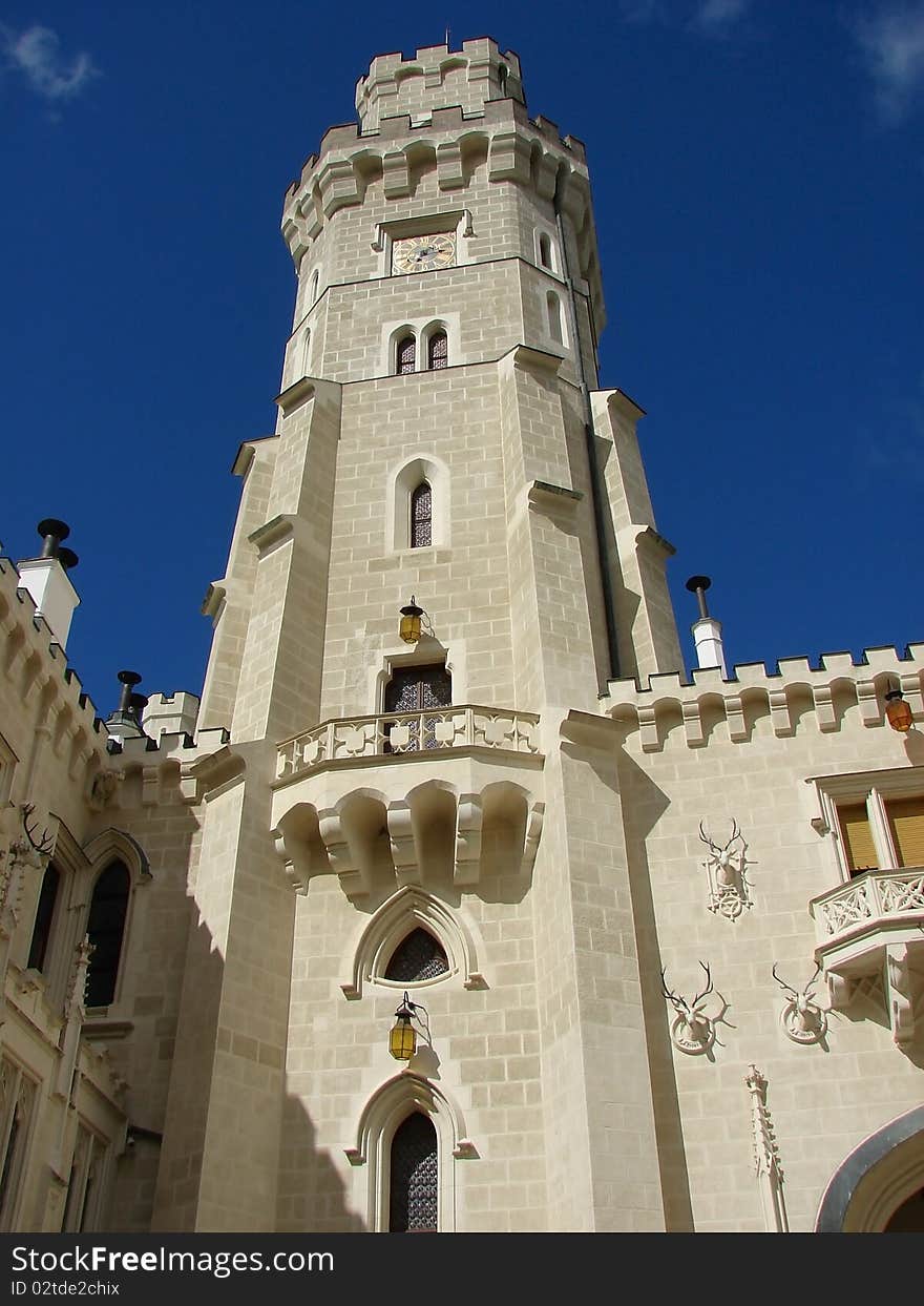 White decorated chateau tower with battlement. White decorated chateau tower with battlement.